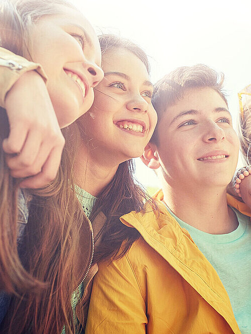 friendship and people concept - group of happy teenage students or friends outdoors