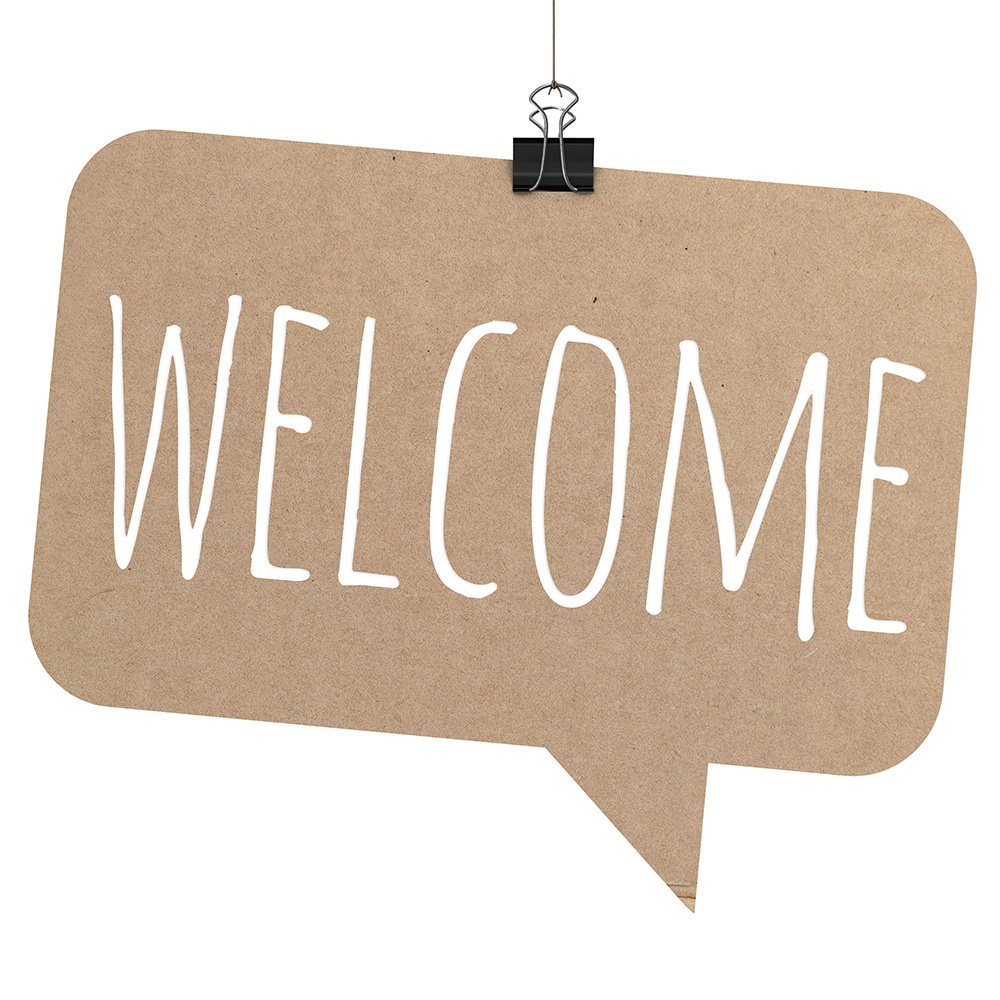 Un panneau en carton sur lequel il est écrit "Welcome"