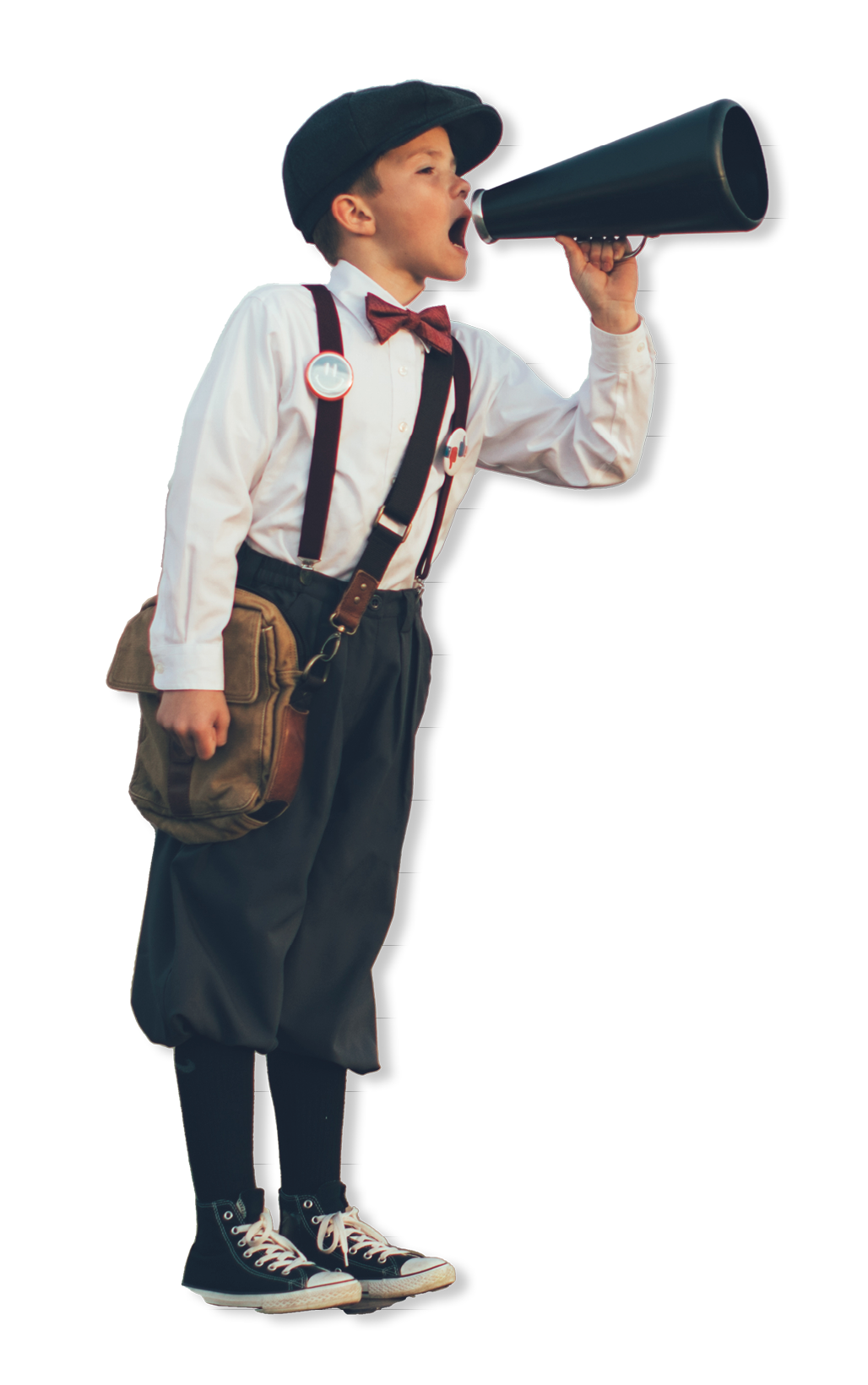 A news boy dressed in vintage knickers and newsboy hat stands yelling through a megaphone in the middle of a field in Utah, USA  He is trying to sell you what your business needs 